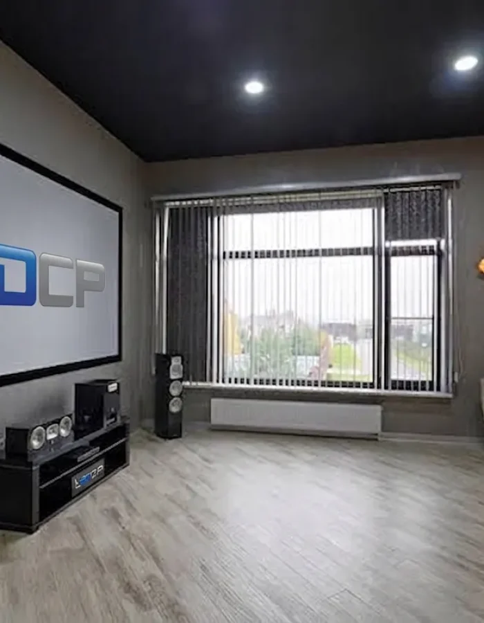 A black painted ceiling transforms this modern living room into a striking focal point while adding depth, contrast, and visual interest.