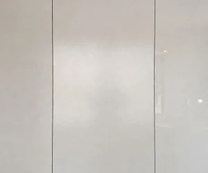 Satin vs matte vs gloss paint finish comparison on three wall panels showing sheen and light reflection
