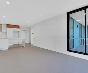 Modern apartment showing should the ceiling and walls be the same color with white painted surfaces and natural lighting.